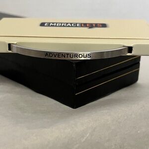 Embracelet Silver Tone Bracelet inscribed with the word Adventurous